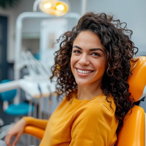 Happy dental patient in treatment chair