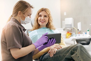Patient and dental team member having friendly conversation