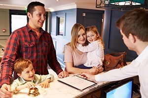 Family of four checking in at emergency dental office