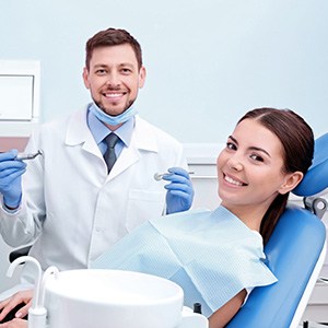 Smiling patient attending appointment for tooth extractions in Bloomfield