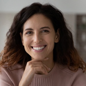 Woman smiling after dental implant failure and salvage in Bloomfield