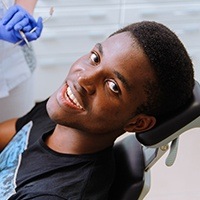 Teen boy in dental office for emergency dental care