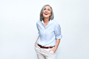 Confident, mature woman enjoying the benefits of implant dentures