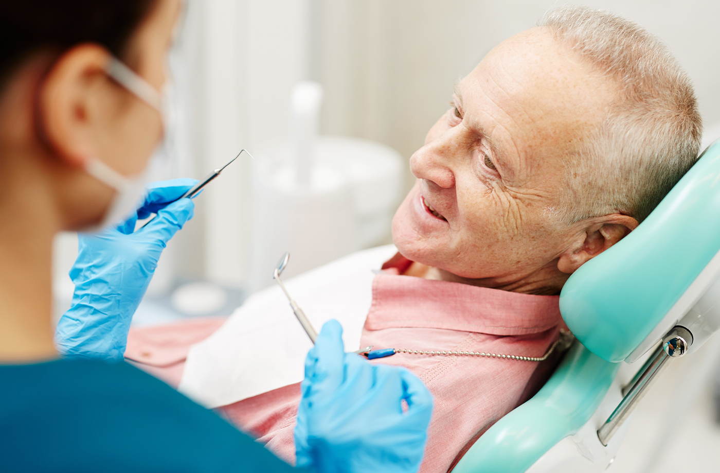 Dentist in Bloomfield showing a dental patient their X rays