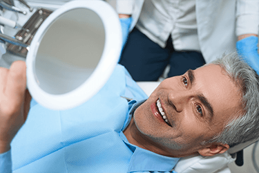 Man smiling at the dentist