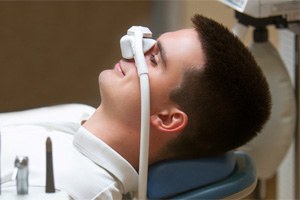 Male patient relaxing while wearing nitrous oxide nose mask