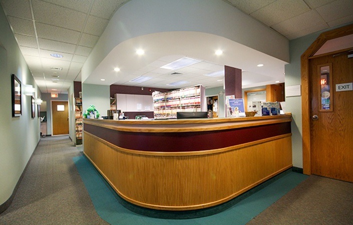 Hallway leading away fro dental office reception desk