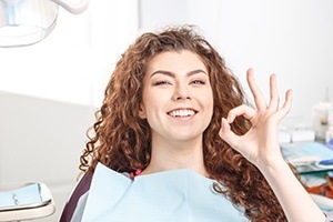 Woman smiling after oral cancer screening