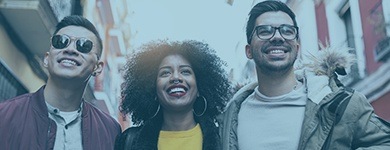 Three people smiling after periodontal therapy