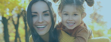 Mother and child smiling after children's dentistry