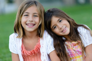 The dentist near me helps a child’s developing tooth enamel. 