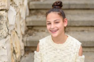 Smiling girl with braces for children in Bloomfield