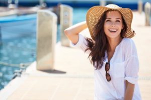 Smiling woman standing on dock