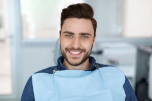 Smiling, handsome male dental patient