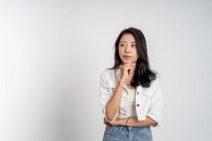 Serious woman wearing contemplative expression 